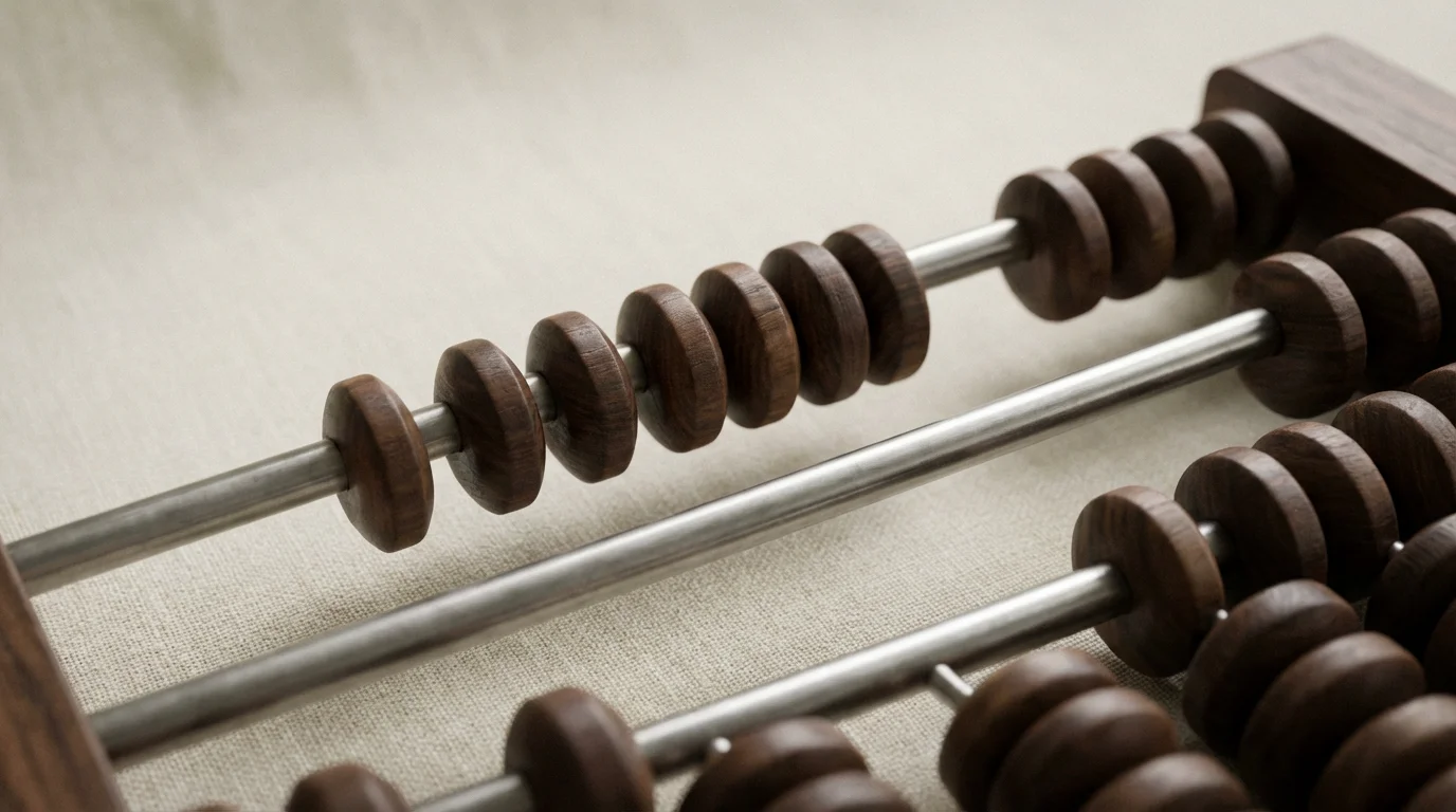 A close-up macro photo of a modern abacus representing financial calculations for taxes.